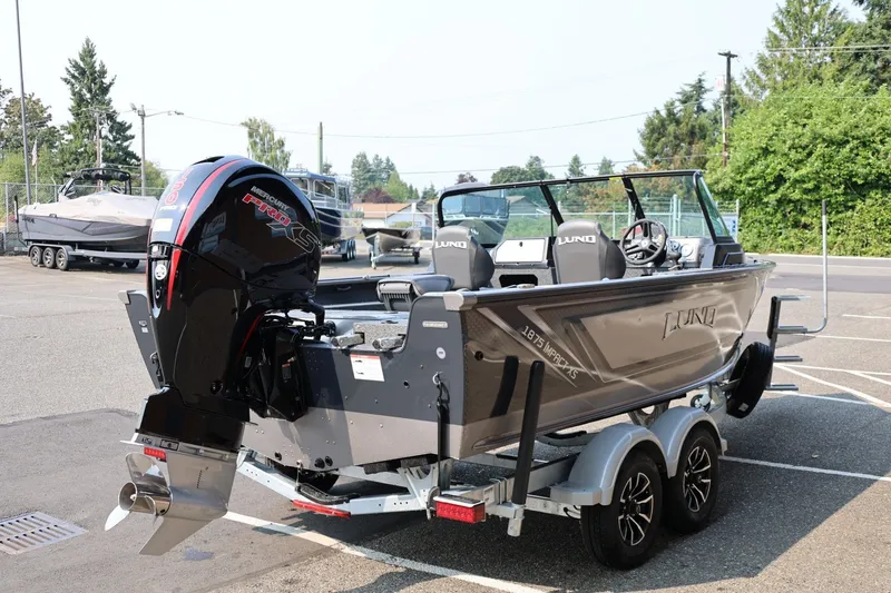 Slide: The Image of 2027 Lund 1875 Impact XS Sport boat with Mercury Pro XS engine on trailer. - 7