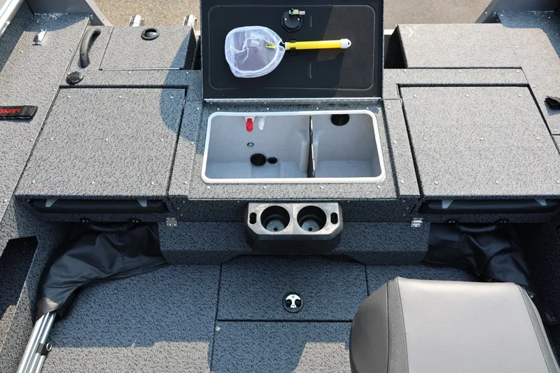 Slide: The Image of 2027 Lund 1875 Impact XS Sport boat interior with storage compartments and cup holders. - 39