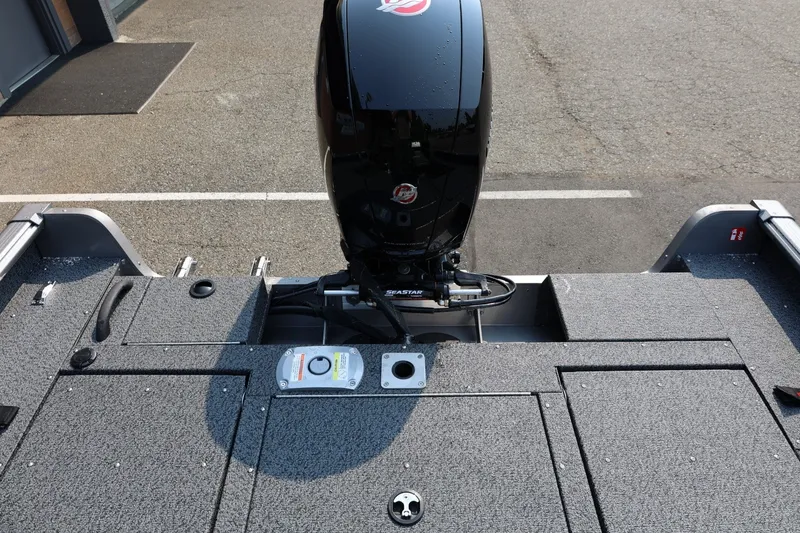 Slide: The Image of 2027 Lund 1875 Impact XS Sport boat with sleek motor and spacious deck design. - 44