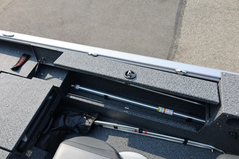 Slide: The Image of 2027 Lund 1875 Impact XS Sport boat interior with storage compartments and seating. - 38