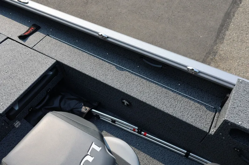 Slide: The Image of Interior view of 2027 Lund 1875 Impact XS Sport boat, showcasing seating and storage. - 37