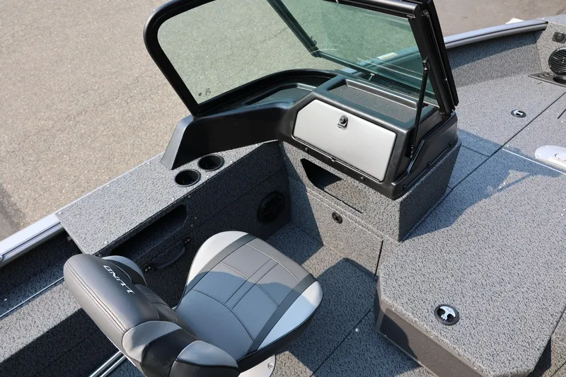 Slide: The Image of 2027 Lund 1875 Impact XS Sport boat interior with seating and console. - 31