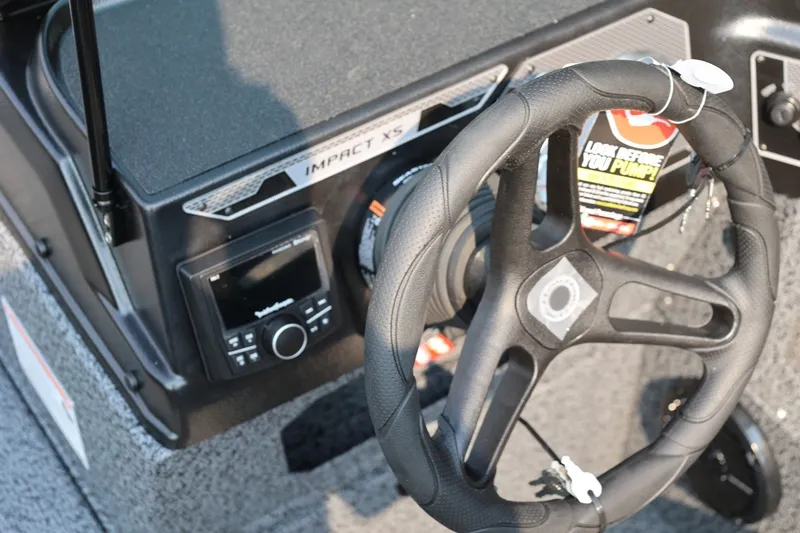 Slide: The Image of Steering wheel and dashboard of 2027 Lund 1875 Impact XS Sport boat. - 28
