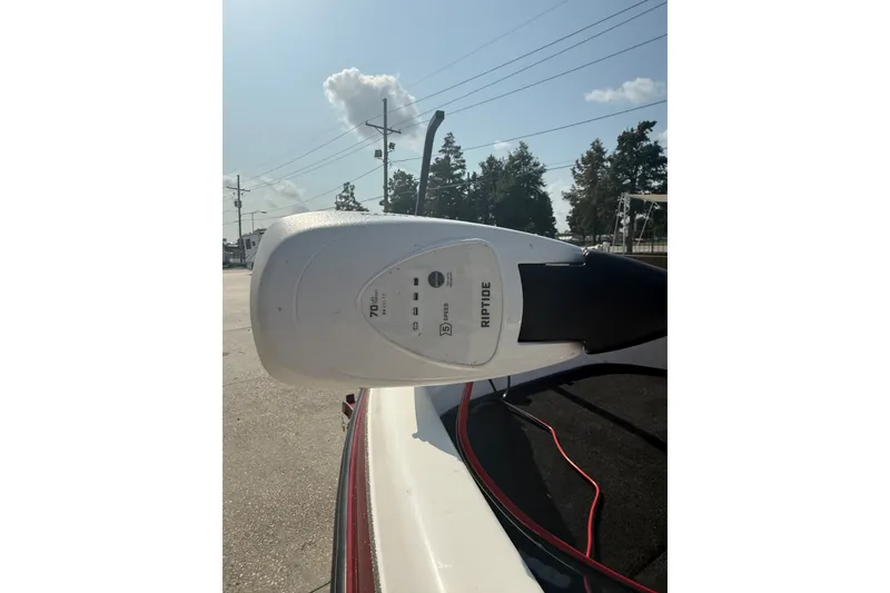 Slide: The Image of 2006 Skeeter SL 190 boat with Riptide trolling motor in sunny outdoor setting. - 8