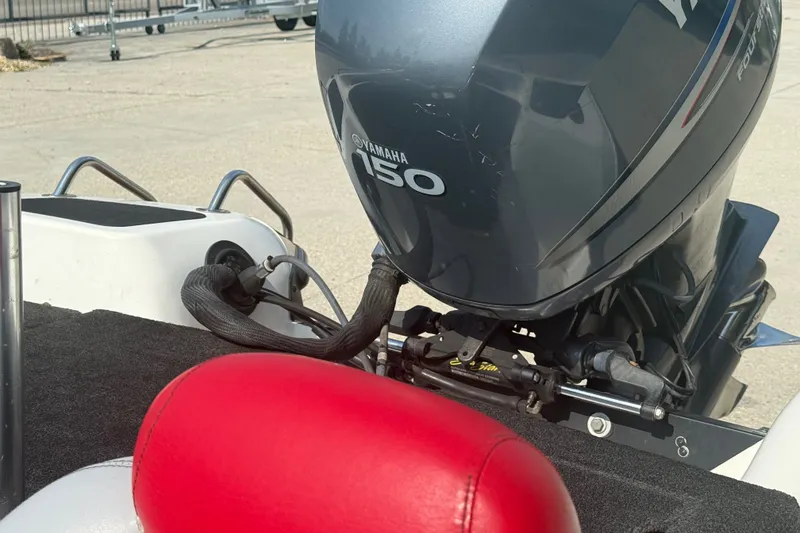 Slide: The Image of 2006 Skeeter SL 190 boat with Yamaha 150 outboard motor, featuring red seating. - 13
