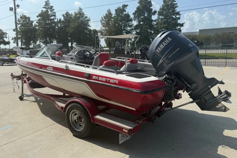 Slide: The Image of 2006 Skeeter SL 190 boat with Yamaha outboard motor on a trailer. - 5