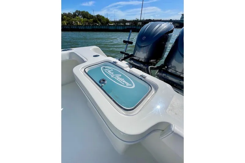 Slide: The Image of 2027 Pair Customs 27 Center Console boat with dual engines on a sunny day. - 17