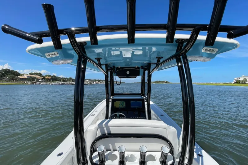 Slide: The Image of 2027 Pair Customs 27 Center Console boat on water, featuring sleek design and modern equipment. - 14