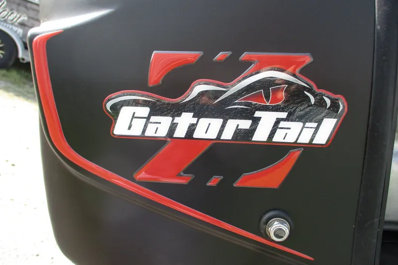 Slide: The Image of GatorTail 1854 Extreme 2027 logo on black surface with red accents. - 13