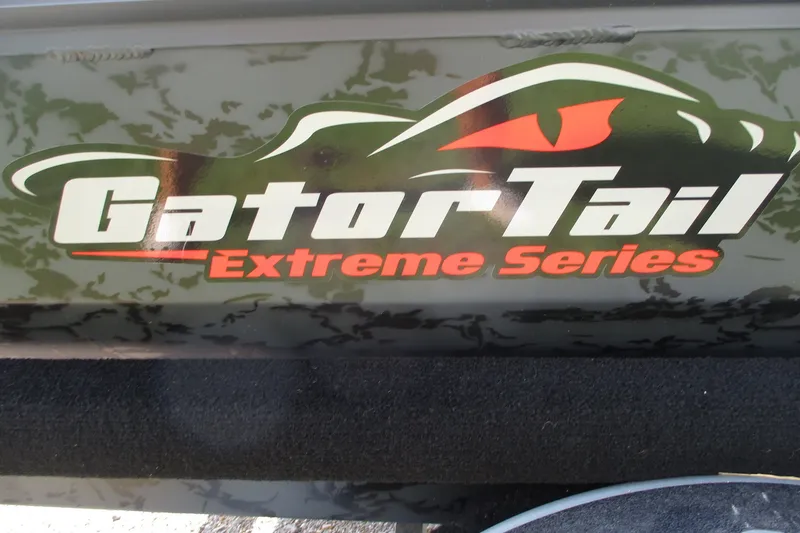 Slide: The Image of GatorTail 1854 Extreme Series logo on camouflage background, 2027 model. - 12