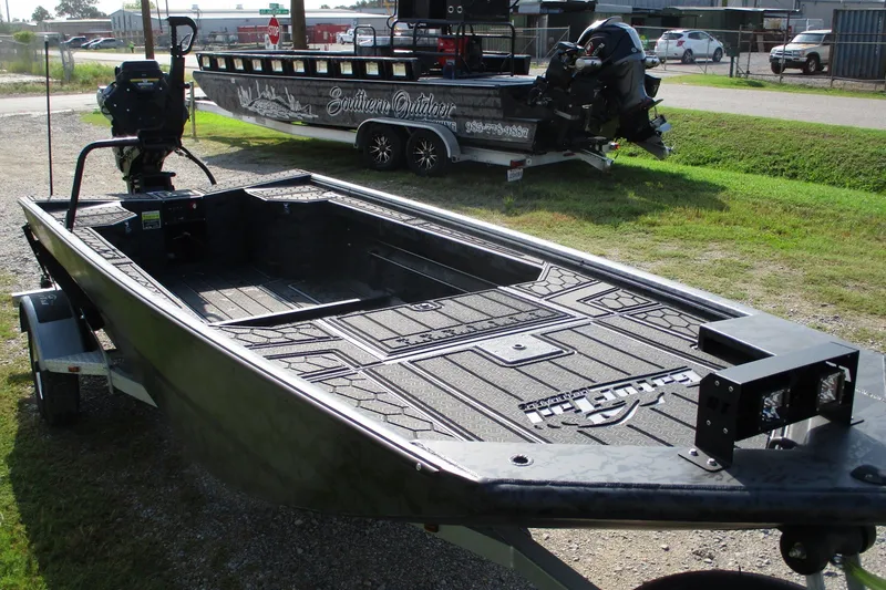 Slide: The Image of 2027 Gatortail 1854 Extreme boat on trailer, outdoor setting, showcasing design and build. - 1