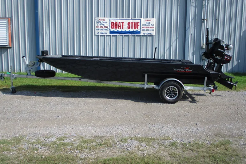 The Image of 2027 Gatortail 1854 Extreme boat on trailer outside a metal building. - 0