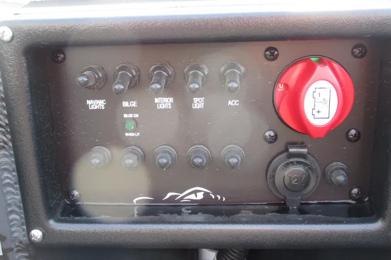 Slide: The Image of Control panel of a 2027 Gatortail 1854 Extreme boat with switches and battery indicator. - 11