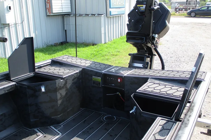 Slide: The Image of 2027 Gatortail 1854 Extreme boat interior with storage compartments and motor. - 7