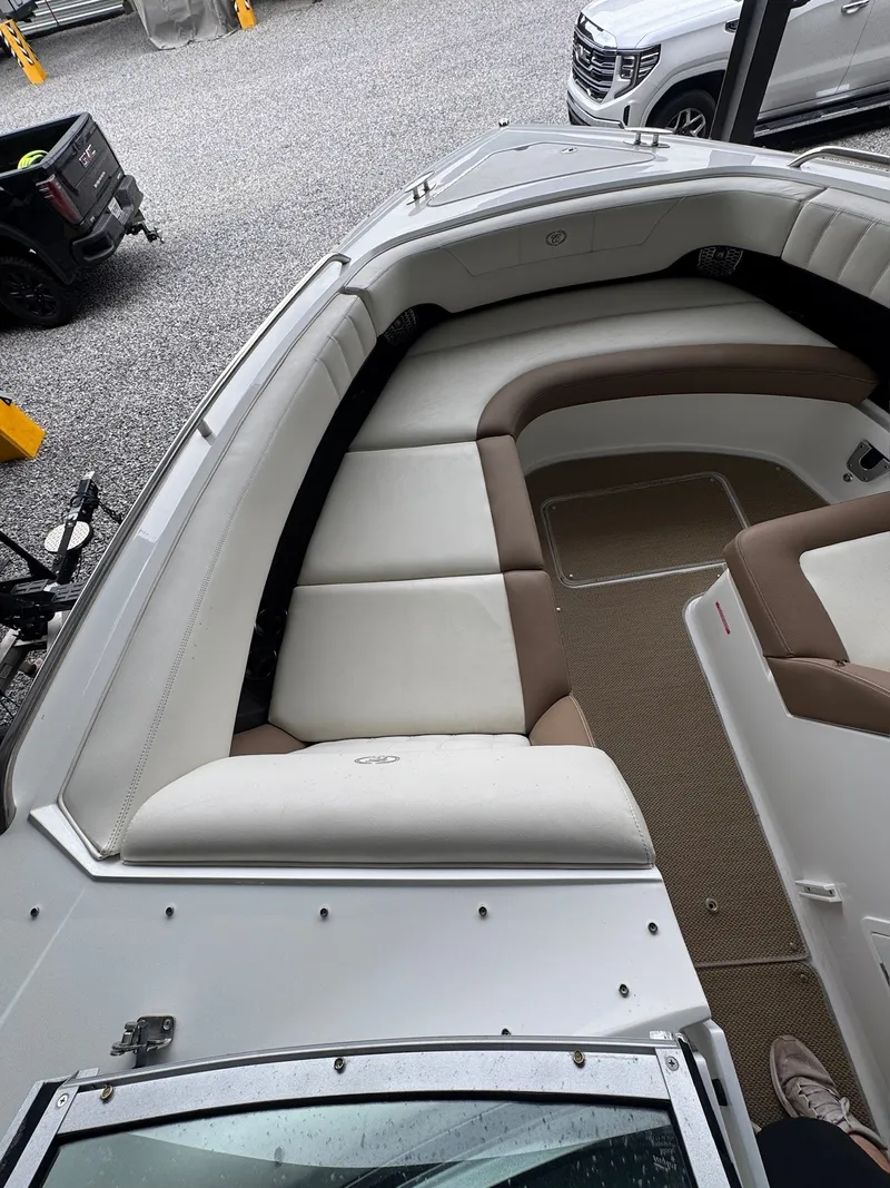 Slide: The Image of 2015 Cobalt 296: Spacious bow area with cushioned seating and carpeted floor. - 14