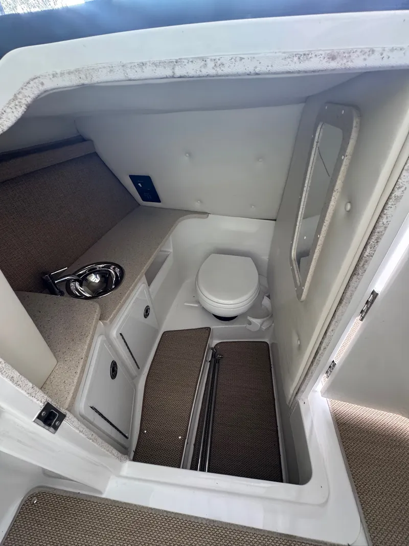 Slide: The Image of Interior of a 2015 Cobalt 296 featuring a toilet and sink. - 12