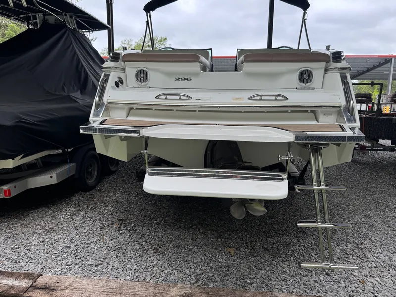 Slide: The Image of The image shows the rear of a 2015 Cobalt 296 boat with a swim platform and ladder. - 5