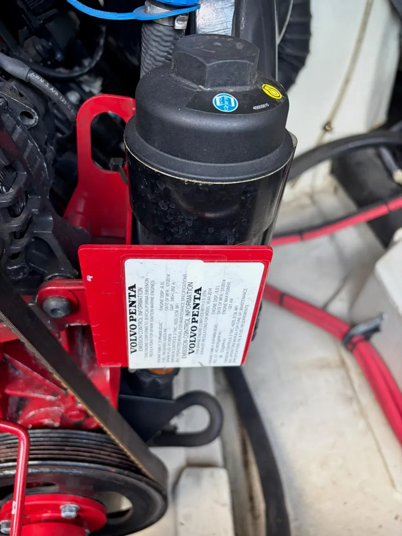 Slide: The Image of Close-up of a Volvo Penta engine in a 2015 Cobalt 296 boat. - 30