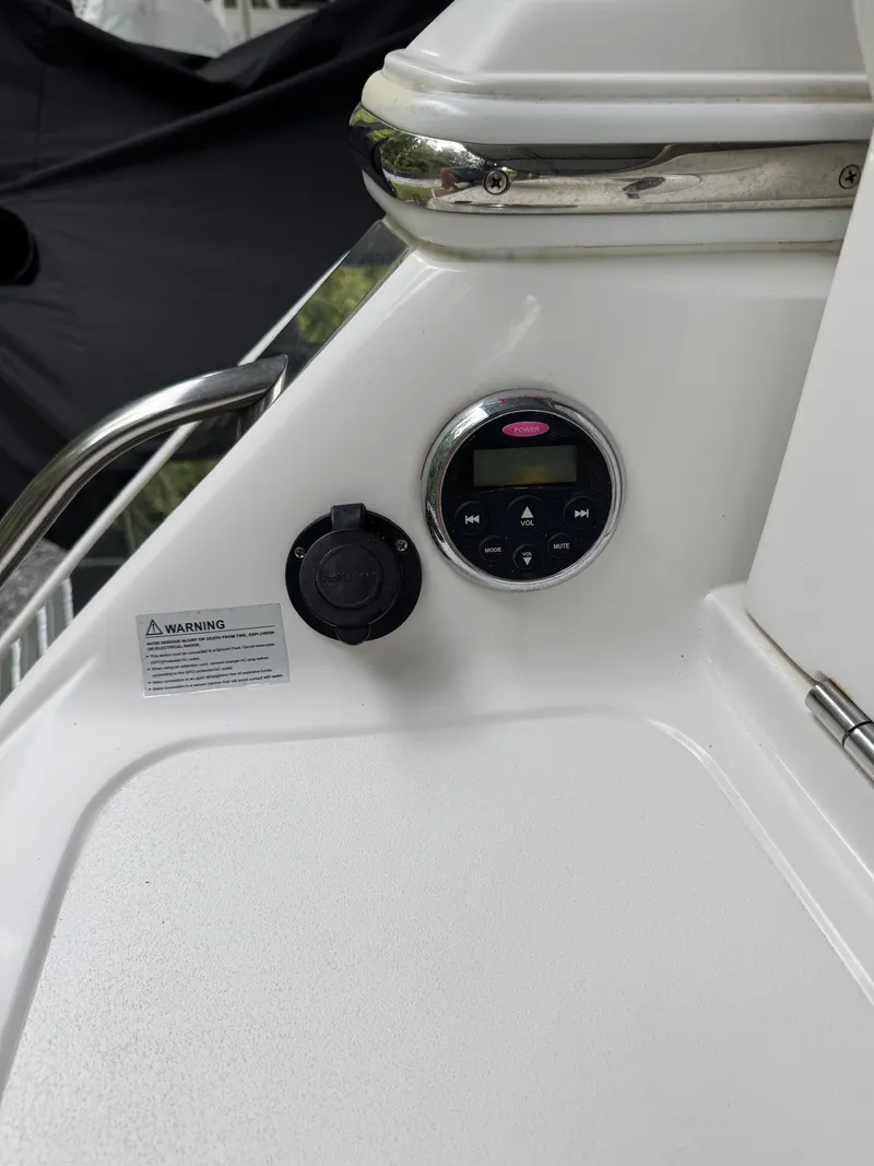 Slide: The Image of Close-up of a helm station with a round display and a warning label. - 6