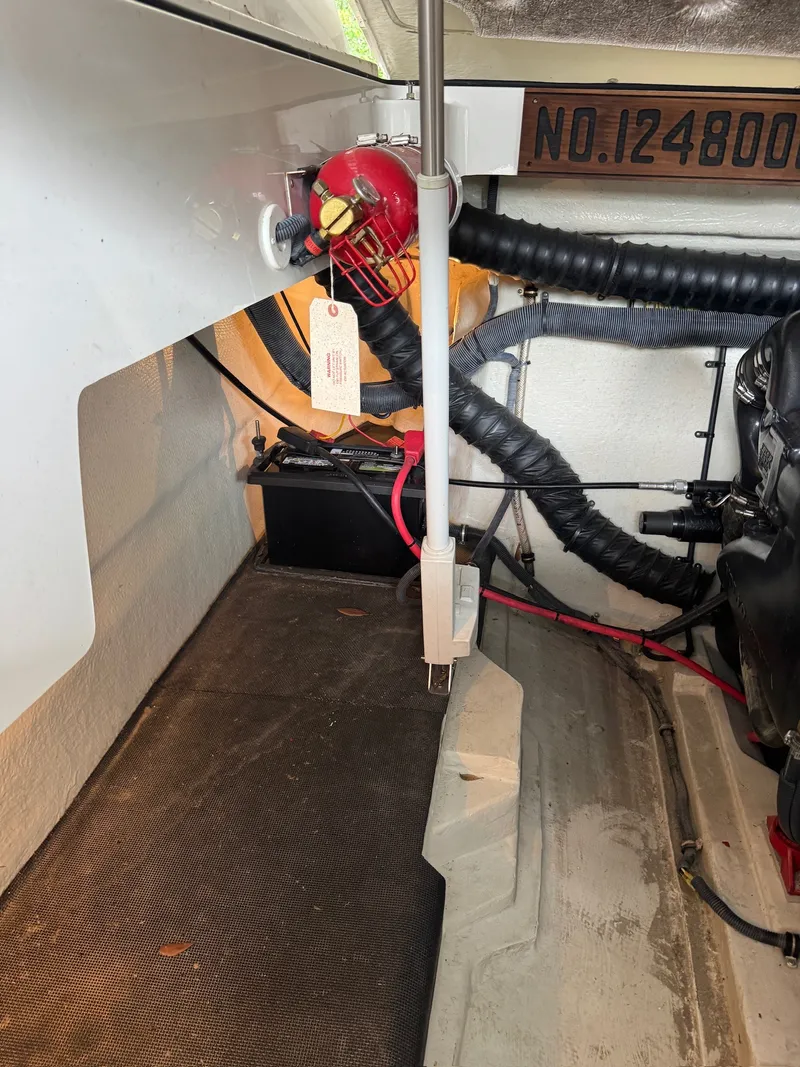 Slide: The Image of Engine compartment of a 2015 Cobalt 296 with wiring and fire extinguisher. - 25