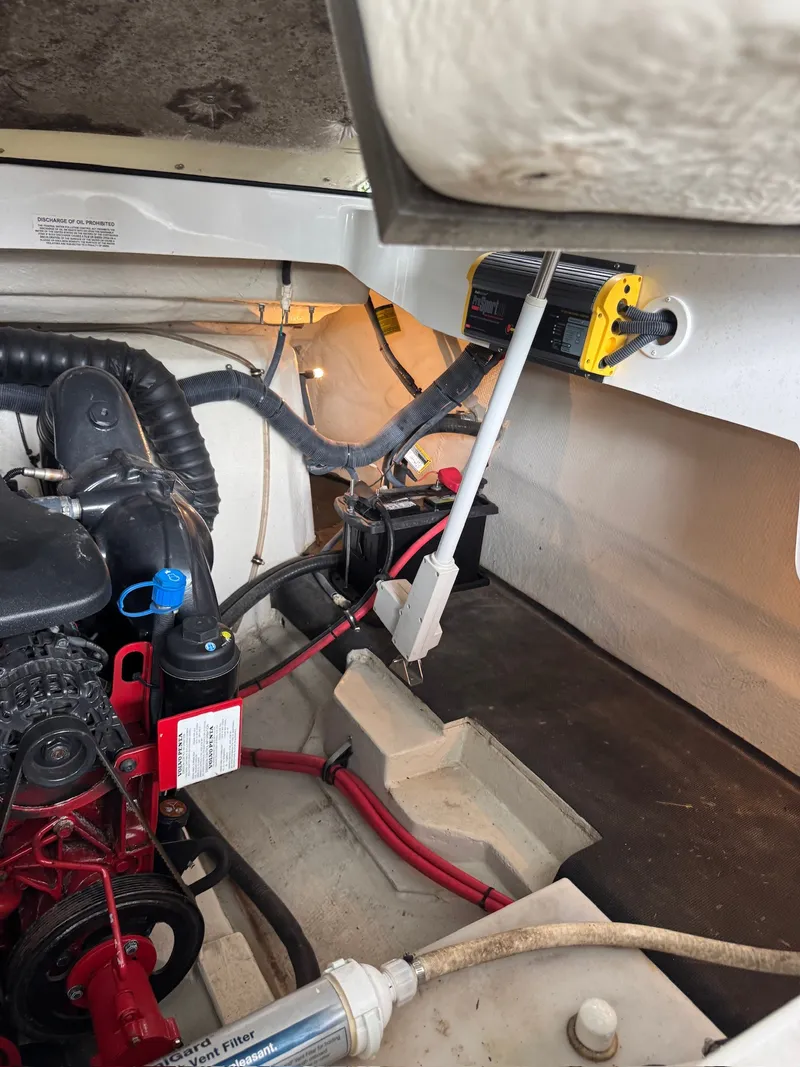 Slide: The Image of Engine compartment of a 2015 Cobalt 296 boat with visible cables and hoses. - 27