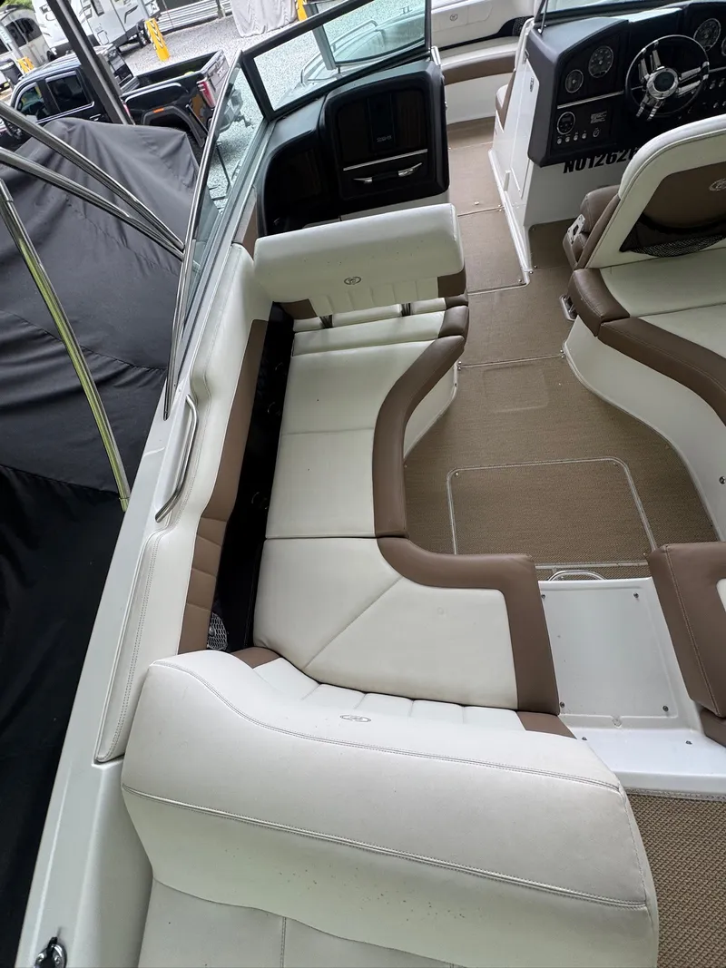 Slide: The Image of Interior of a 2015 Cobalt 296 boat with beige and brown seating. - 8