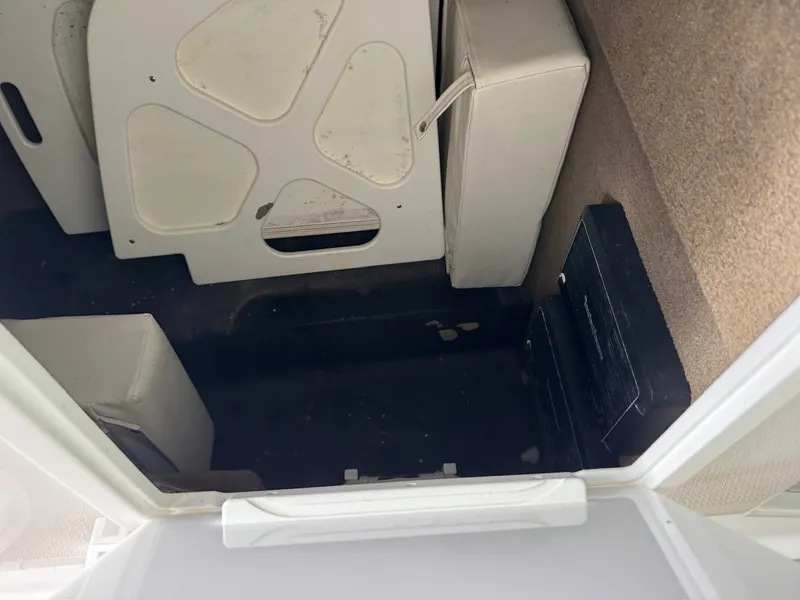 Slide: The Image of Interior of a 2015 Cobalt 296 boat with storage space and upholstery. - 20