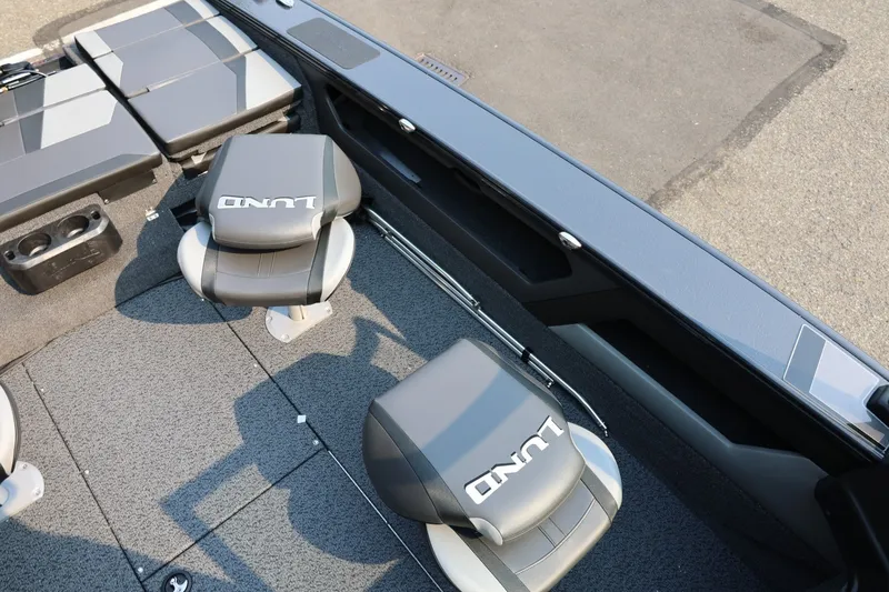 Slide: The Image of Interior view of a Lund 1875 Crossover XS boat with gray seats and carpeted floor. - 25