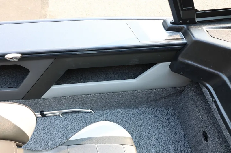 Slide: The Image of Interior view of a Lund 1875 Crossover XS boat with gray carpet flooring and cushioned seating. - 39