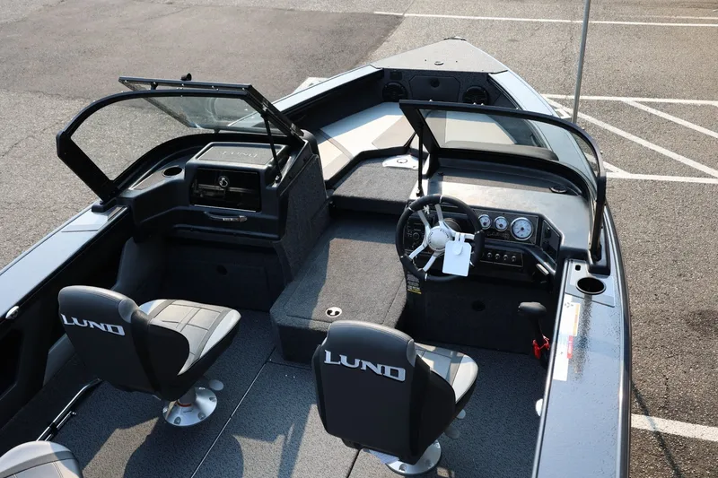 Slide: The Image of Lund 1875 Crossover XS 2027: Spacious cockpit with two padded seats, steering console, and storage area. - 49