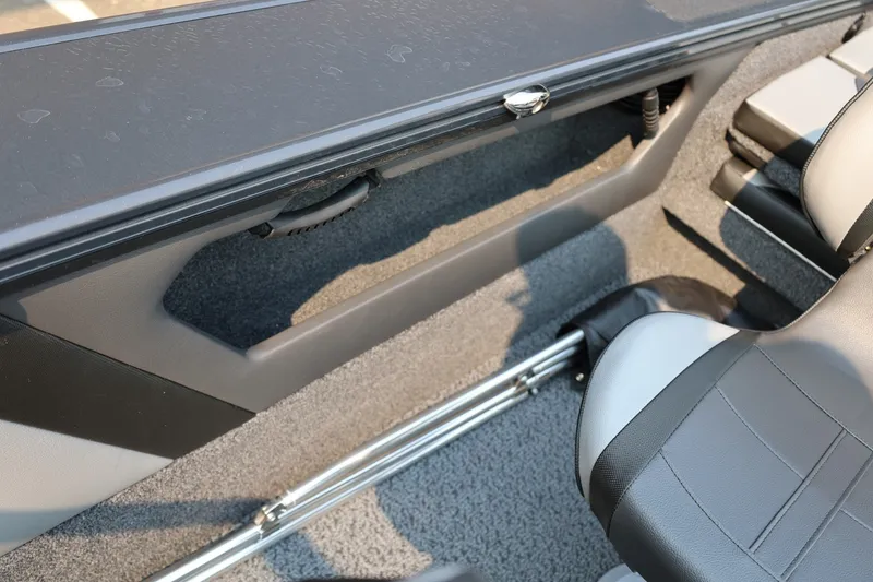 Slide: The Image of Interior view of a 2027 Lund 1875 Crossover XS with gray seats and carpeted flooring. - 41
