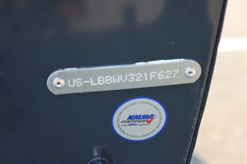 Slide: The Image of Close-up of a boat plaque with serial number and NMMA certification seal. - 7