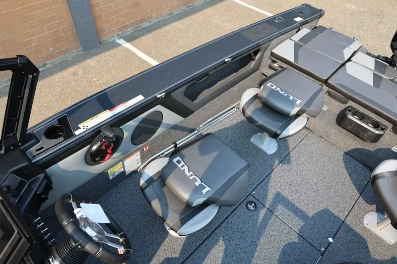 Slide: The Image of Interior view of a Lund 1875 Crossover XS boat with gray seats and steering wheel. - 24