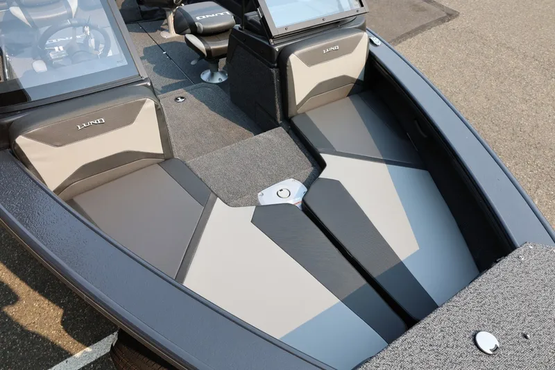 Slide: The Image of The image shows the bow of a Lund 1875 Crossover XS boat with gray upholstery. - 15