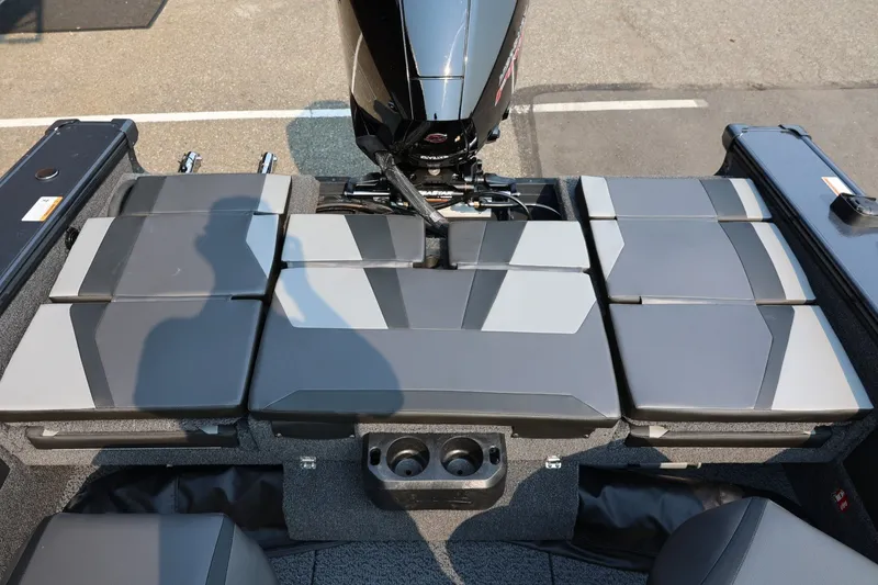 Slide: The Image of Rear view of a 2027 Lund 1875 Crossover XS with gray cushioned seats and an outboard motor. - 43