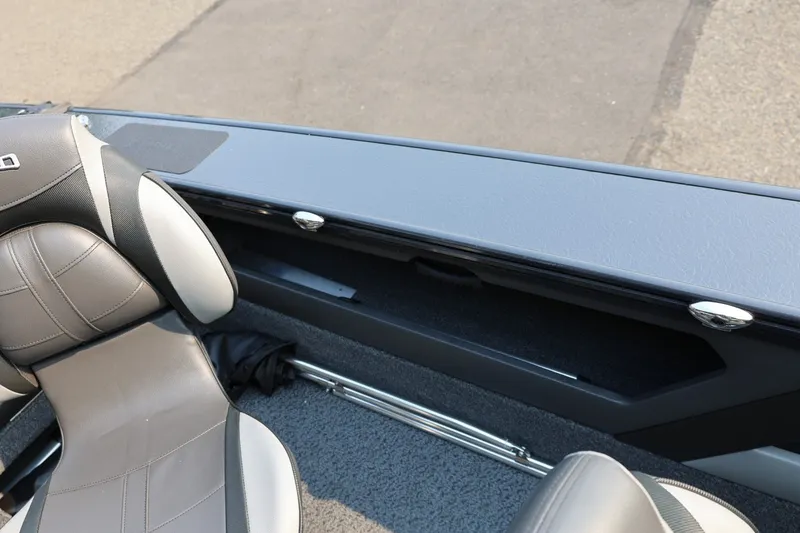 Slide: The Image of Interior view of a boat with gray seats and storage compartment. - 40