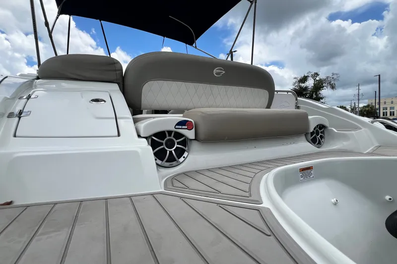 Slide: The Image of 2023 Crownline Eclipse E235 XS boat interior with seating and speaker system. - 50