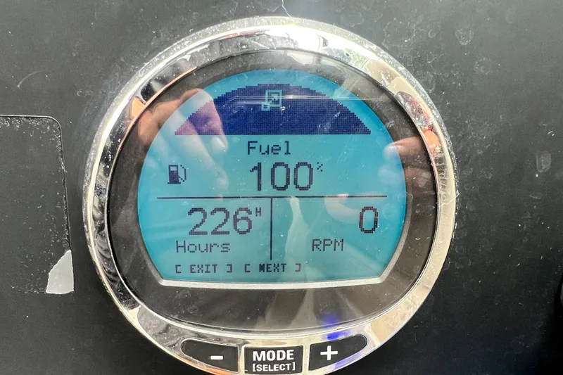 Slide: The Image of Digital display showing 100% fuel, 226 hours, and 0 RPM on 2023 Crownline Eclipse E235 XS. - 61