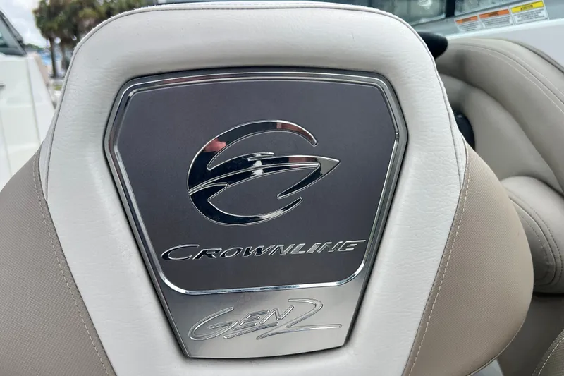 Slide: The Image of 2023 Crownline Eclipse E235 XS boat seat with logo and emblem detail. - 88
