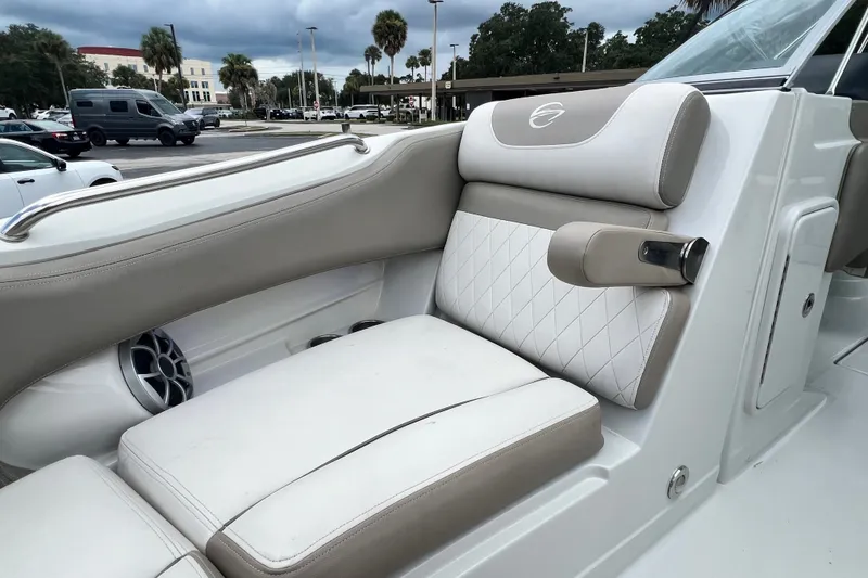 Slide: The Image of 2023 Crownline Eclipse E235 XS boat interior with luxurious seating and speaker system. - 76