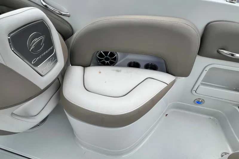 Slide: The Image of 2023 Crownline Eclipse E235 XS boat seating with cup holders and speaker. - 89