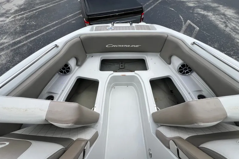 Slide: The Image of 2023 Crownline Eclipse E235 XS boat interior with seating and storage compartments. - 79