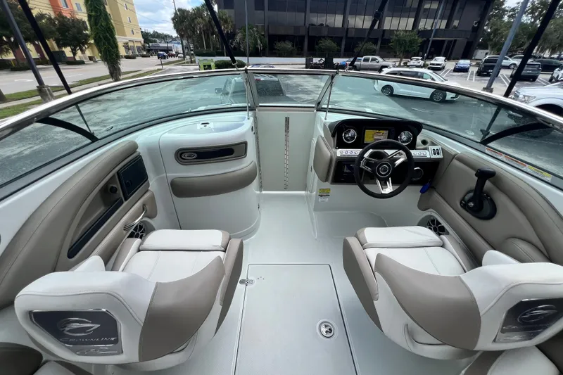 Slide: The Image of 2023 Crownline Eclipse E235 XS boat interior with modern dashboard and seating. - 63