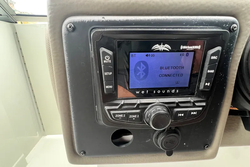 Slide: The Image of 2023 Crownline Eclipse E235 XS audio system with Bluetooth connectivity display. - 72