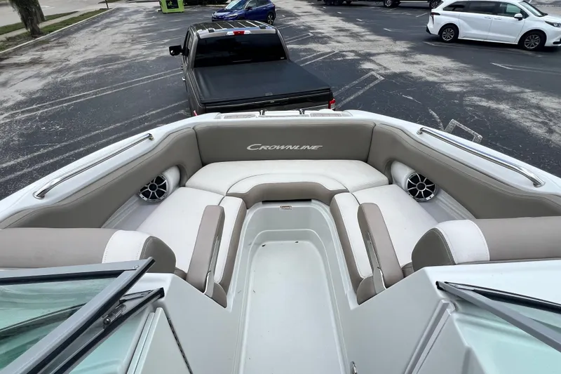 Slide: The Image of 2023 Crownline Eclipse E235 XS boat interior with spacious seating and modern design. - 74