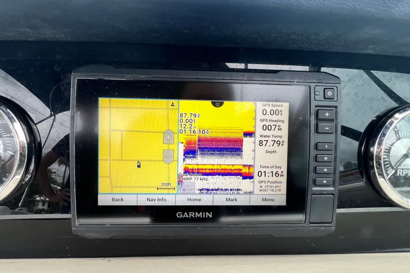 Slide: The Image of Garmin GPS display on 2023 Crownline Eclipse E235 XS boat dashboard. - 69
