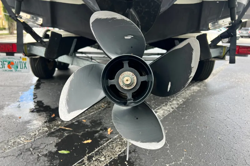 Slide: The Image of Propeller of 2023 Crownline Eclipse E235 XS boat on trailer, close-up view. - 42