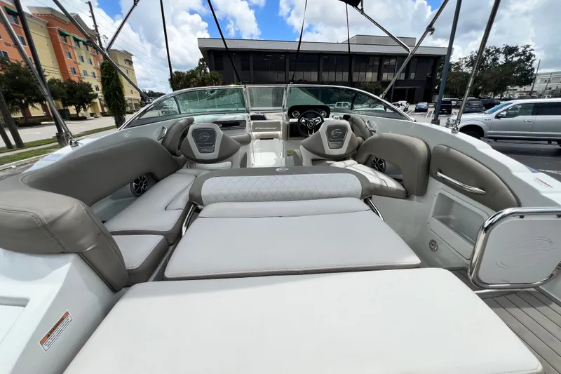 Slide: The Image of 2023 Crownline Eclipse E235 XS boat interior with luxurious seating and modern design. - 56