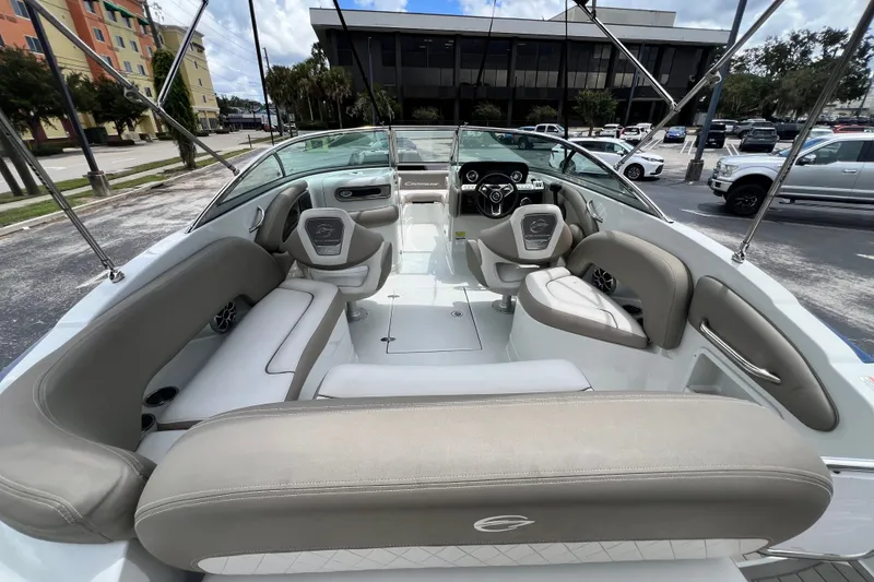Slide: The Image of 2023 Crownline Eclipse E235 XS boat interior with spacious seating and modern design. - 54