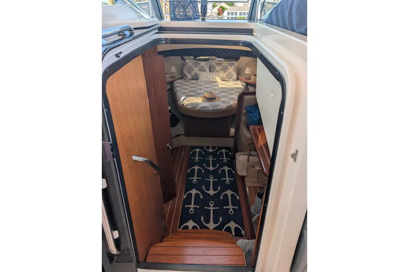 Slide: The Image of Interior cabin of a 2000 Pursuit 3400 Express boat with nautical decor. - 16